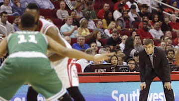 Nov 16, 2015; Houston, TX, USA; Boston Celtics head coach Brad Stevens watches Houston Rockets guard James Harden (13) dribble against Boston Celtics guard Evan Turner (11) in the second half at Toyota Center. Celtics won 111 to 95. Mandatory Credit: Thomas B. Shea-USA TODAY Sports