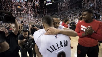 Apr 29, 2016; Portland, OR, USA; Portland Trail Blazers guard Damian Lillard (0) hugs guard CJ McCollum (3) after defeating the Los Angeles Clippers 106-103 in game six of the first round of the NBA Playoffs at Moda Center at the Rose Quarter. Mandatory Credit: Troy Wayrynen-USA TODAY Sports