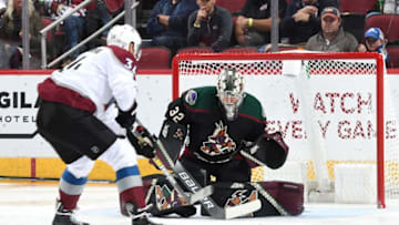 GLENDALE, AZ - NOVEMBER 23: Goalie Antti Raanta #32 of the Arizona Coyotes attempts to stop the shot of Carl Soderberg #34 of the Colorado Avalanche during the first period at Gila River Arena on November 23, 2018 in Glendale, Arizona. (Photo by Norm Hall/NHLI via Getty Images)