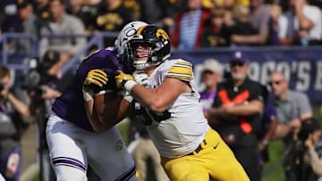 EVANSTON, IL - OCTOBER 21: Anthony Nelson #98 of the Iowa Hawkeyes rushes against Rashawn Slater #70 of the Northwestern Wildcats at Ryan Field on October 21, 2017 in Evanston, Illinois. Northwestern defeated Iowa 17-10 in overtime. (Photo by Jonathan Daniel/Getty Images)