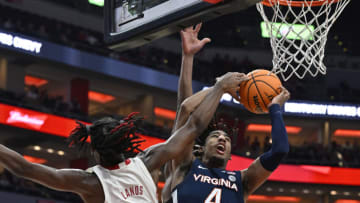 Feb 15, 2023; Louisville, Kentucky, USA; Virginia Cavaliers guard Armaan Franklin (4) draws a foul from Louisville Cardinals forward Kamari Lands (22) while shooting during the first half at KFC Yum! Center. Mandatory Credit: Jamie Rhodes-USA TODAY Sports