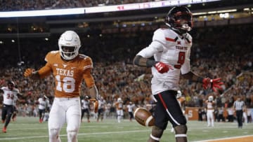 AUSTIN, TX - NOVEMBER 24: T.J. Vasher #9 of the Texas Tech Red Raiders catches a pass for a touchdown defended by Davante Davis #18 of the Texas Longhorns in the fourth quarter at Darrell K Royal-Texas Memorial Stadium on November 24, 2017 in Austin, Texas. (Photo by Tim Warner/Getty Images)