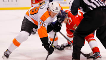 Mar 10, 2022; Sunrise, Florida, USA; Philadelphia Flyers center Patrick Brown (38) and Florida Panthers center Eetu Luostarinen (27) face-off during the first period at FLA Live Arena. Mandatory Credit: Sam Navarro-USA TODAY Sports