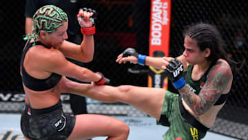 LAS VEGAS, NEVADA - AUGUST 15: In this handout image provided by UFC, Livinha Souza (R) of Brazil kicks Ashley Yoder in their strawweight bout during the UFC 252 event at UFC APEX on August 15, 2020 in Las Vegas, Nevada. (Photo by Jeff Bottari/Zuffa LLC via Getty Images)