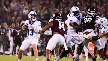 Nov 4, 2023; Starkville, Mississippi, USA;Kentucky Wildcats quarterback Devin Leary (13) looks to pass against the Mississippi State Bulldogs during the first quarter at Davis Wade Stadium at Scott Field. Mandatory Credit: Matt Bush-USA TODAY Sports
