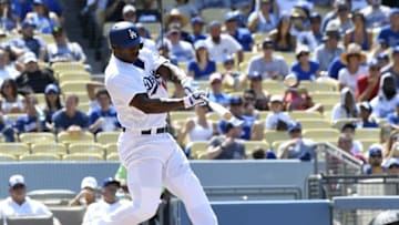 Jul 31, 2016; Los Angeles, CA, USA; Los Angeles Dodgers right fielder Yasiel Puig (66) hits an RBI double against the Arizona Diamondbacks during the fifth inning at Dodger Stadium. Mandatory Credit: Richard Mackson-USA TODAY Sports