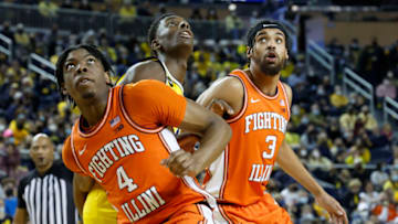 Feb 27, 2022; Ann Arbor, Michigan, USA; Illinois Fighting Illini forward Omar Payne (4) and Iguard Jacob Grandison (3) box out Michigan Wolverines forward Moussa Diabate (14) in the first half at Crisler Center. Mandatory Credit: Rick Osentoski-USA TODAY Sports