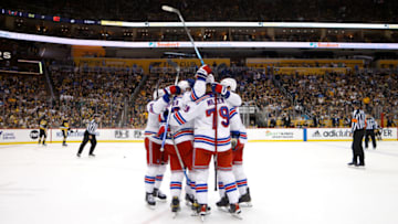 PITTSBURGH, PA - MAY 13: Chris Kreider #20 of the New York Rangers is congratulated by his teammates after scoring the game winning goal during the third period in Game Six of the First Round of the 2022 Stanley Cup Playoffs against the Pittsburgh Penguins at PPG PAINTS Arena on May 13, 2022 in Pittsburgh, Pennsylvania. New York defeated Pittsburgh 5-3. (Photo by Kirk Irwin/Getty Images)