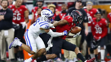 DETROIT, MI - DECEMBER 26: Jauan Wesley #9 of the Northern Illinois Huskies makes a first half catch next to Michael Carter II #26 of the Duke Blue Devils that he ran in for a touchdown during the Quick Lane Bowl at Ford Field on December 26, 2017 in Detroit Michigan. (Photo by Gregory Shamus/Getty Images)
