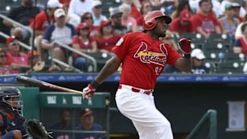 Mar 12, 2016; Jupiter, FL, USA; St. Louis Cardinals first baseman David Washington (93) follows through with a base hit against the Houston Astros during the game at Roger Dean Stadium. The Cardinals defeated the Astros 4-3. Mandatory Credit: Scott Rovak-USA TODAY Sports