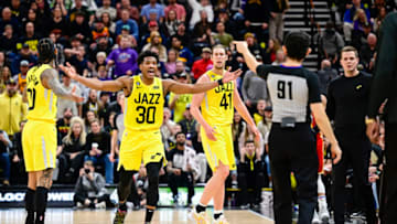 Feb 3, 2023; Salt Lake City, Utah, USA; Utah Jazz guard Ochai Agbaji (30), forward/center Kelly Olynyk (41), and head coach Will Hardy react to a referee's call against the Atlanta Hawks during the second half at Vivint Arena. Mandatory Credit: Christopher Creveling-USA TODAY Sports