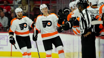 RALEIGH, NC - NOVEMBER 21: Morgan Frost #48 of the Philadelphia Flyers celebrates with the bench after scoring a goal during an NHL game against the Carolina Hurricanes on November 21, 2019 at PNC Arena in Raleigh, North Carolina. (Photo by Gregg Forwerck/NHLI via Getty Images)