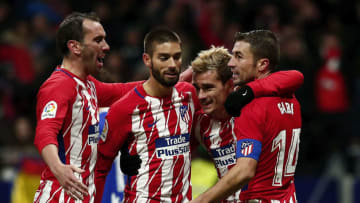 MADRID, SPAIN - DECEMBER 02: Antoine Griezmann (2ndR) of Atletico de Madrid celebrates scoring their second goal with teammates Gabi Fernandez (R); Yannick Carrasco (2ndL) and Diego Godin (L) during the La Liga match between Club Atletico Madrid and Real Sociedad de Futbol at Estadio Wanda Metropolitano on December 2, 2017 in Madrid, Spain. (Photo by Gonzalo Arroyo Moreno/Getty Images)