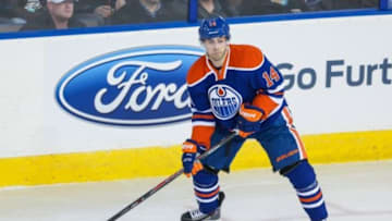 Mar 18, 2014; Edmonton, Alberta, CAN; Edmonton Oilers right wing Jordan Eberle (14) controls the puck against the Nashville Predators during the second period at Rexall Place. Edmonton Oilers won 5-1. Mandatory Credit: Sergei Belski-USA TODAY Sports