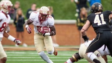 Nov 9, 2013; Winston-Salem, NC, USA; Florida State Seminoles running back Karlos Williams (9) runs the ball during the third quarter against the Wake Forest Demon Deacons at BB