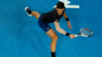 MELBOURNE, AUSTRALIA - JANUARY 20: Novak Djokovic of Serbia stretches for the ball during his third round match against Albert Ramos-Vinolas of Spain on day six of the 2018 Australian Open at Melbourne Park on January 20, 2018 in Melbourne, Australia. (Photo by Scott Barbour/Getty Images)