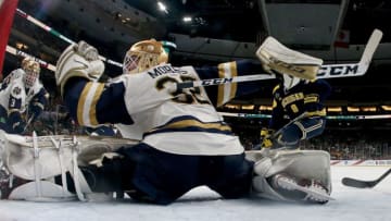 ST PAUL, MN - APRIL 05: Cale Morris #32 of the Notre Dame Fighting Irish stops a shot in the third period against the Michigan Wolverines during the semifinals of the 2018 NCAA Division I Men's Hockey Championships on April 5, 2018 at Xcel Energy Center in St Paul, Minnesota. (Photo by Elsa/Getty Images)