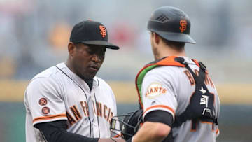 Jun 23, 2016; Pittsburgh, PA, USA; San Francisco Giants relief pitcher Santiago Casilla (left) and catcher Trevor Brown (14) shake hands after defeating the Pittsburgh Pirates at PNC Park. The Giants won 5-3. Mandatory Credit: Charles LeClaire-USA TODAY Sports