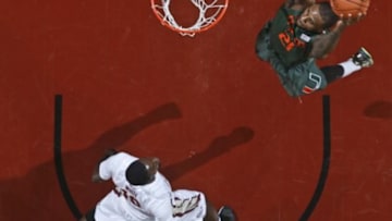 Feb 10, 2014; Tallahassee, FL, USA; Miami Hurricanes forward Erik Swoope (21) attempts a dunk as Florida State Seminoles forward Okaro White (10) watches in the first half at the Donald L. Tucker Center. Mandatory Credit: Phil Sears-USA TODAY Sports