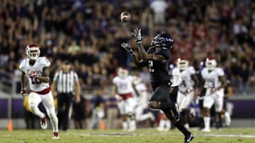 Oct 1, 2016; Fort Worth, TX, USA; TCU Horned Frogs wide receiver Taj Williams (2) scores a touchdown past Oklahoma Sooners safety Steven Parker (10) during the second half at Amon G. Carter Stadium. Mandatory Credit: Kevin Jairaj-USA TODAY Sports