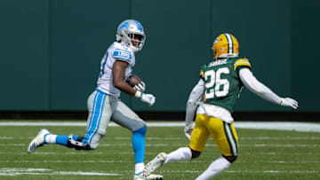 GREEN BAY, WISCONSIN - SEPTEMBER 20: Kerryon Johnson #33 of the Detroit Lions runs with the ball while being chased by Darnell Savage #26 of the Green Bay Packers in the second quarter at Lambeau Field on September 20, 2020 in Green Bay, Wisconsin. (Photo by Dylan Buell/Getty Images)