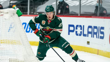 Jan 24, 2021; Saint Paul, Minnesota, USA; Minnesota Wild forward Kirill Kaprizov (97) carries the puck during the second period against the San Jose Sharks at Xcel Energy Center. Mandatory Credit: Brace Hemmelgarn-USA TODAY Sports