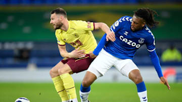 LIVERPOOL, ENGLAND - MARCH 13: Erik Pieters of Burnley battles for possession with Alex Iwobi of Everton during the Premier League match between Everton and Burnley at Goodison Park on March 13, 2021 in Liverpool, England. Sporting stadiums around the UK remain under strict restrictions due to the Coronavirus Pandemic as Government social distancing laws prohibit fans inside venues resulting in games being played behind closed doors. (Photo by Peter Powell - Pool/Getty Images)