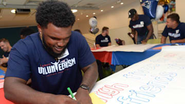 BOSTON, MA - JUNE 20: New England Patriot's rookie Ja.Whaun Bentley makes a sign for the kids at Boston Children's Hospital June 20, 2018 in Boston, Massachusetts. (Photo by Darren McCollester/Getty Images for Boston Children's Hospital)