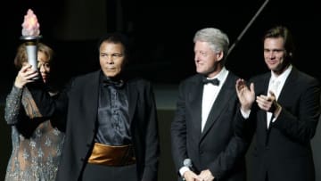 US boxing legend Muhammad Ali (2nd L) and wife Lonnie (L) along with US President Bill Clinton (2nd R) and friend and actor Jim Carrey (R) on stage, 19 November 2005, during the Grand Opening Gala for the Muhammad Ali Center at the Kentucky Center in Louisville, KY. The Ali Center will open to the public 21 November, costing 80 million USD for the 93,000 square-foot six level center to be used as a 'global gathering place' to promote peace and tolerance, and to inspire people to reach their potential. AFP PHOTO/JEFF HAYNES (Photo credit should read JEFF HAYNES/AFP/Getty Images)