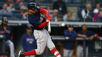 NEW YORK, NY - MAY 10: Mookie Betts #50 of the Boston Red Sox singles to center against the New York Yankees in the third inning at Yankee Stadium on May 10, 2018 in the Bronx borough of New York City. (Photo by Mike Stobe/Getty Images)