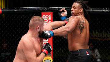 LAS VEGAS, NEVADA - DECEMBER 19: (L-R) Marcin Tybura of Poland and Greg Hardy trade punches in a heavyweight fight during the UFC Fight Night event at UFC APEX on December 19, 2020 in Las Vegas, Nevada. (Photo by Cooper Neill/Zuffa LLC)