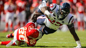 KANSAS CITY, MO - OCTOBER 13: Morris Claiborne #20 of the Kansas City Chiefs tackles Carlos Hyde #23 of the Houston Texans in the second quarter at Arrowhead Stadium on October 13, 2019 in Kansas City, Missouri. (Photo by David Eulitt/Getty Images)
