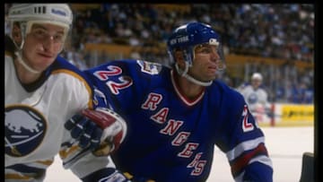 15 Oct 1993: Rightwinger Mike Gartner of the New York Rangers (right) works against the Buffalo Sabres during a game at Memorial Auditorium in Buffalo, New York. Mandatory Credit: Rick Stewart /Allsport