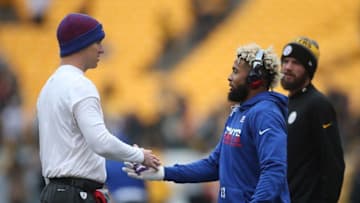 Dec 4, 2016; Pittsburgh, PA, USA; New York Giants quarterback Eli Manning (L) and wide receiver Odell Beckham (RC) greet each other before playing the Pittsburgh Steelers at Heinz Field. Mandatory Credit: Charles LeClaire-USA TODAY Sports