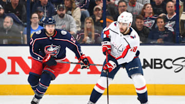 COLUMBUS, OH - APRIL 19: Chandler Stephenson #18 of the Washington Capitals skates the puck away from Ryan Murray #27 of the Columbus Blue Jackets during the third period in Game Four of the Eastern Conference First Round during the 2018 NHL Stanley Cup Playoffs on April 19, 2018 at Nationwide Arena in Columbus, Ohio. (Photo by Jamie Sabau/NHLI via Getty Images)