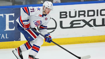 SYRACUSE, NY - APRIL 22: Filip Cederqvist #71 of Rochester Americans moves the puck against the Syracuse Crunch during Game 2 of the north division semifinals of the Calder Cup Playoffs at Upstate Medical University Arena on April 22, 2023 in Syracuse, New York. (Photo by Isaiah Vazquez/Getty Images)