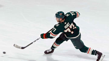 ST. PAUL, MN - APRIL 04: Brad Hunt #77 of the Minnesota Wild takes a shot on goal during a game with the Boston Bruins at Xcel Energy Center on April 4, 2019 in St. Paul, Minnesota.(Photo by Bruce Kluckhohn/NHLI via Getty Images)