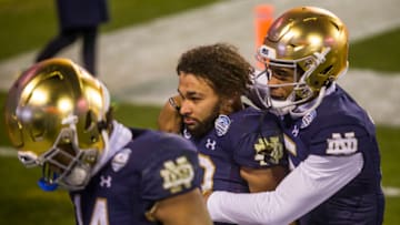 Dec. 19, 2020; Charlotte, NC, USA; Notre Dames Kyren Williams (23) is comforted by teammate Jordan Johnson (15) as they head to the locker room following the ACC Championship football game on Saturday, Dec. 19, 2020, inside Bank of America Stadium in Charlotte, NC. Clemson won 34-10. Mandatory Credit: Robert Franklin/South Bend Tribune via USA TODAY NETWORK