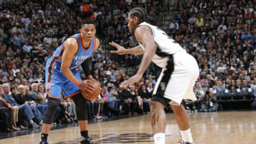 SAN ANTONIO, TX - MAY 2: Russell Westbrook #0 of the Oklahoma City Thunder handles the ball against Kawhi Leonard #2 of the San Antonio Spurs in Game Two of the Western Conference Semifinals during the 2016 NBA Playoffs on May 2, 2016 at the AT&T Center in San Antonio, Texas. NOTE TO USER: User expressly acknowledges and agrees that, by downloading and or using this photograph, user is consenting to the terms and conditions of the Getty Images License Agreement. Mandatory Copyright Notice: Copyright 2016 NBAE (Photos by Chris Covatta/NBAE via Getty Images)