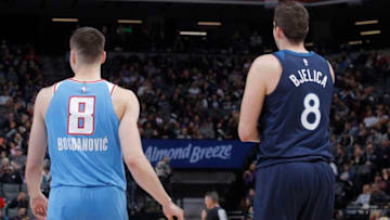 SACRAMENTO, CA - FEBRUARY 26: Bogdan Bogdanovic #8 of the Sacramento Kings faces off against Nemanja Bjelica #8 of the Minnesota Timberwolves on February 26, 2018 at Golden 1 Center in Sacramento, California. NOTE TO USER: User expressly acknowledges and agrees that, by downloading and or using this photograph, User is consenting to the terms and conditions of the Getty Images Agreement. Mandatory Copyright Notice: Copyright 2018 NBAE (Photo by Rocky Widner/NBAE via Getty Images)