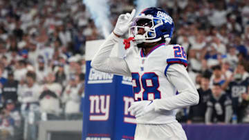EAST RUTHERFORD, NJ - SEPTEMBER 26: Cor'Dale Flott #28 of the New York Giants runs out during introductions against the Dallas Cowboys at MetLife Stadium on September 26, 2022 in East Rutherford, New Jersey. (Photo by Cooper Neill/Getty Images)