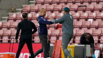 SOUTHAMPTON, ENGLAND - JULY 05: Ralph Hasenhuttle, Manager of Southampton greets Pep Guardiola, Manager of Manchester City following the Premier League match between Southampton FC and Manchester City at St Mary's Stadium on July 05, 2020 in Southampton, England. Football Stadiums around Europe remain empty due to the Coronavirus Pandemic as Government social distancing laws prohibit fans inside venues resulting in games being played behind closed doors. (Photo by Will Oliver/Pool via Getty Images)