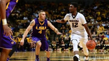 Jan 8, 2015; Columbia, MO, USA; Missouri Tigers guard Namon Wright (12) dribbles the ball as LSU Tigers guard Keith Hornsby (4) defends during the second half at Mizzou Arena. The Missouri Tigers defeated the LSU Tigers 74-67. Mandatory Credit: Dak Dillon-USA TODAY Sports