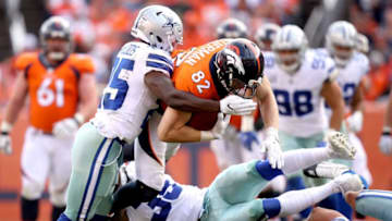 DENVER, CO - SEPTEMBER 17: Kavon Frazier #35 and Xavier Woods #25 of the Dallas Cowboys tackle Jeff Heuerman #82 of the Denver Broncos at Sports Authority Field at Mile High on September 17, 2017 in Denver, Colorado. (Photo by Matthew Stockman/Getty Images)
