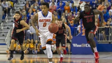 Jan 2, 2016; Gainesville, FL, USA; Florida Gators guard Kasey Hill (0) dribbles the ball up the court in the first half against the Georgia Bulldogs at Stephen C. O