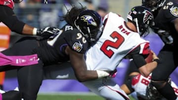 Oct 19, 2014; Baltimore, MD, USA; Baltimore Ravens linebacker Pernell McPhee (90) sacks Atlanta Falcons quarterback Matt Ryan (2) in the second quarter at M&T Bank Stadium. Mandatory Credit: Evan Habeeb-USA TODAY Sports