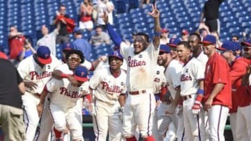 Jul 19, 2015; Philadelphia, PA, USA; Philadelphia Phillies shortstop Freddy Galvis (13) and teammates wait for Philadelphia Phillies right fielder Jeff Francoeur (3) (not pictured) after he hit a walk off two run home run during the ninth inning against the Miami Marlins at Citizens Bank Park. The Phillies defeated the Marlins, 8-7. Mandatory Credit: Eric Hartline-USA TODAY Sports