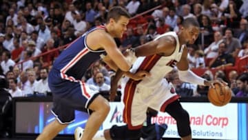 Oct 29, 2014; Miami, FL, USA; Miami Heat forward Chris Bosh (1) dribbles as Washington Wizards forward Kris Humphries (43) defends during the second half at American Airlines Arena. Miami won 107-95. Mandatory Credit: Steve Mitchell-USA TODAY Sports
