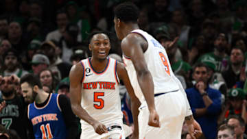 BOSTON, MASSACHUSETTS - MARCH 05: Immanuel Quickley #5 of the New York Knicks reacts with RJ Barrett #9 after scoring against the Boston Celtics during overtime at the TD Garden on March 05, 2023 in Boston, Massachusetts. NOTE TO USER: User expressly acknowledges and agrees that, by downloading and or using this photograph, User is consenting to the terms and conditions of the Getty Images License Agreement. (Photo by Brian Fluharty/Getty Images)