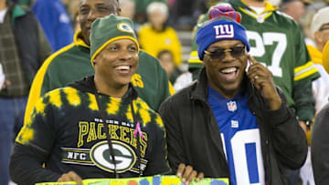 Oct 9, 2016; Green Bay, WI, USA; A Green Bay Packers fans and a New York Giants fan look on during warmups prior to the game at Lambeau Field. Mandatory Credit: Jeff Hanisch-USA TODAY Sports